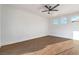 A spacious bedroom with wood floors, white walls, and ample natural light at 1136 Casady Hollow Ave, Henderson, NV 89012