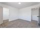 A spacious bedroom with carpet, offering access to closet and other rooms at 1136 Casady Hollow Ave, Henderson, NV 89012