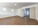 Spacious bedroom with wood floors, white walls, and natural light at 1136 Casady Hollow Ave, Henderson, NV 89012