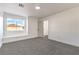 Bright bedroom featuring neutral carpet, white trim, and a window with views at 1136 Casady Hollow Ave, Henderson, NV 89012