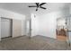 Spacious bedroom with carpet, ceiling fan and connecting bathroom and kitchen views at 1136 Casady Hollow Ave, Henderson, NV 89012