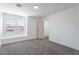 Bright, carpeted bedroom with neutral walls and neighborhood views at 1136 Casady Hollow Ave, Henderson, NV 89012