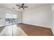 Light-filled bedroom with wood floors and a sliding glass door to balcony at 1136 Casady Hollow Ave, Henderson, NV 89012