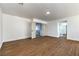 Bright bedroom featuring wood floors and double door entry to hallway at 1136 Casady Hollow Ave, Henderson, NV 89012