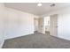 Spacious bedroom featuring neutral carpet and an ensuite bathroom with double sinks at 1136 Casady Hollow Ave, Henderson, NV 89012