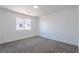 Clean bedroom featuring plush carpet, white walls, and a window that provides natural light at 1136 Casady Hollow Ave, Henderson, NV 89012