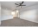 Spacious bonus room with neutral carpet and ceiling fan, perfect for entertaining or relaxing at 1136 Casady Hollow Ave, Henderson, NV 89012