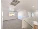 Spacious bonus room features neutral carpet, modern fan, and lots of natural light from the window at 1136 Casady Hollow Ave, Henderson, NV 89012