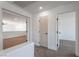 Hallway with doors leading to rooms, carpeted floor and neutral decor at 1136 Casady Hollow Ave, Henderson, NV 89012