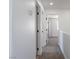 Bright hallway with doors, showcasing a neutral color palette at 1136 Casady Hollow Ave, Henderson, NV 89012