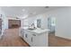 Modern kitchen featuring a central island and stainless steel appliances with an open-concept design at 1136 Casady Hollow Ave, Henderson, NV 89012