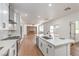 Modern kitchen with quartz counters, stainless appliances, open to living room at 1136 Casady Hollow Ave, Henderson, NV 89012