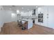 Stylish kitchen featuring an island with seating, and modern appliances for cooking at 1136 Casady Hollow Ave, Henderson, NV 89012