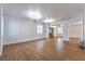 Spacious living room with modern lighting and beautiful wood-look floors at 1136 Casady Hollow Ave, Henderson, NV 89012