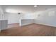 Spacious living room showcasing wood-style flooring and large windows to add natural lighting at 1136 Casady Hollow Ave, Henderson, NV 89012