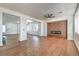 Open concept living room with modern fireplace and beautiful flooring at 1136 Casady Hollow Ave, Henderson, NV 89012