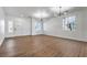 Spacious living room filled with hardwood floors, neutral walls, modern fixtures, and natural light at 1136 Casady Hollow Ave, Henderson, NV 89012