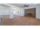 Open-concept living space with modern fireplace, ample natural light, and seamless flow at 1136 Casady Hollow Ave, Henderson, NV 89012