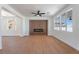 Spacious living room with a modern fireplace and stylish ceiling fan for comfortable living at 1136 Casady Hollow Ave, Henderson, NV 89012