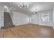 Bright, open living room with wood floors, staircase and modern lighting at 1136 Casady Hollow Ave, Henderson, NV 89012