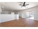 Spacious living room highlighting wood-style flooring and balcony access for outdoor scenery at 1136 Casady Hollow Ave, Henderson, NV 89012