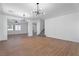 Expansive living area featuring modern light fixtures and staircase at 1136 Casady Hollow Ave, Henderson, NV 89012