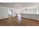Second floor loft area with wood floors, access to balcony, and bathroom at 1136 Casady Hollow Ave, Henderson, NV 89012