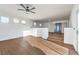Bright loft area with wood floors, balcony doors, and access to bedrooms at 1136 Casady Hollow Ave, Henderson, NV 89012
