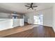 Open loft space with wood floors, balcony access, and open doorway to bathroom at 1136 Casady Hollow Ave, Henderson, NV 89012