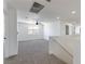 Open loft area with carpet, ceiling fan and staircase at 1136 Casady Hollow Ave, Henderson, NV 89012