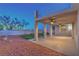 Spacious covered patio with ceiling fans and a landscaped backyard create an outdoor haven at 1136 Casady Hollow Ave, Henderson, NV 89012