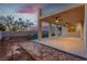 A view of the backyard patio area with ceiling fans and a greenbelt beyond at 1136 Casady Hollow Ave, Henderson, NV 89012