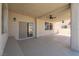Covered patio featuring tiled flooring, ceiling fans, and backyard access at 1136 Casady Hollow Ave, Henderson, NV 89012