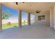 Covered patio with tiled flooring and a view of the landscaped backyard at 1136 Casady Hollow Ave, Henderson, NV 89012
