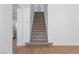 Carpeted staircase with white walls connecting multiple floors at 1136 Casady Hollow Ave, Henderson, NV 89012