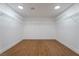 Spacious walk-in closet with ample shelving and wood-look flooring at 1136 Casady Hollow Ave, Henderson, NV 89012
