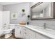 Beautiful bathroom with double sinks, marble countertops, and an oversized mirror at 11550 Velicata Ct, Las Vegas, NV 89138