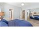 Another view of the bright bedroom, featuring a closet with mirrored doors and an en suite bathroom at 11550 Velicata Ct, Las Vegas, NV 89138