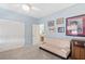 Comfortable bedroom with a futon, closet, and neutral carpet, offering a versatile space at 11550 Velicata Ct, Las Vegas, NV 89138