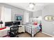 This bedroom features a desk, monitors, chair, bed, and a ceiling fan at 11550 Velicata Ct, Las Vegas, NV 89138
