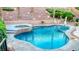 Backyard swimming pool and hot tub featuring flagstone coping and mature landscaping at 11550 Velicata Ct, Las Vegas, NV 89138