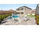 Modern backyard featuring a swimming pool, spa and firepit for entertaining guests in this gorgeous home at 11943 Rockview Point St, Las Vegas, NV 89138
