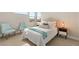 Bright bedroom featuring stylish furnishings, a cozy bed, and bedside tables at 11943 Rockview Point St, Las Vegas, NV 89138