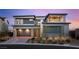 Modern two-story home with a three car garage and xeriscaped front yard at 11943 Rockview Point St, Las Vegas, NV 89138
