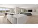 Open-concept kitchen flowing into the living area, featuring a large island with seating and stainless steel appliances at 11943 Rockview Point St, Las Vegas, NV 89138
