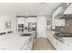 Bright kitchen with white cabinets, stainless steel appliances, and a large island for ample workspace at 11943 Rockview Point St, Las Vegas, NV 89138