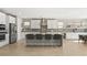 Bright, expansive kitchen with white cabinetry, a large center island with seating, and stainless steel appliances at 11943 Rockview Point St, Las Vegas, NV 89138