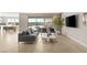 Stylish living room featuring a sliding glass doors, neutral color palette and sleek tile flooring at 11943 Rockview Point St, Las Vegas, NV 89138