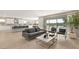 Bright, open-concept living room flows into a modern kitchen, perfect for entertaining guests and Gathering gatherings at 11943 Rockview Point St, Las Vegas, NV 89138