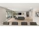 Spacious living room with tile flooring, large sliding doors to the patio, and a modern decor at 11943 Rockview Point St, Las Vegas, NV 89138